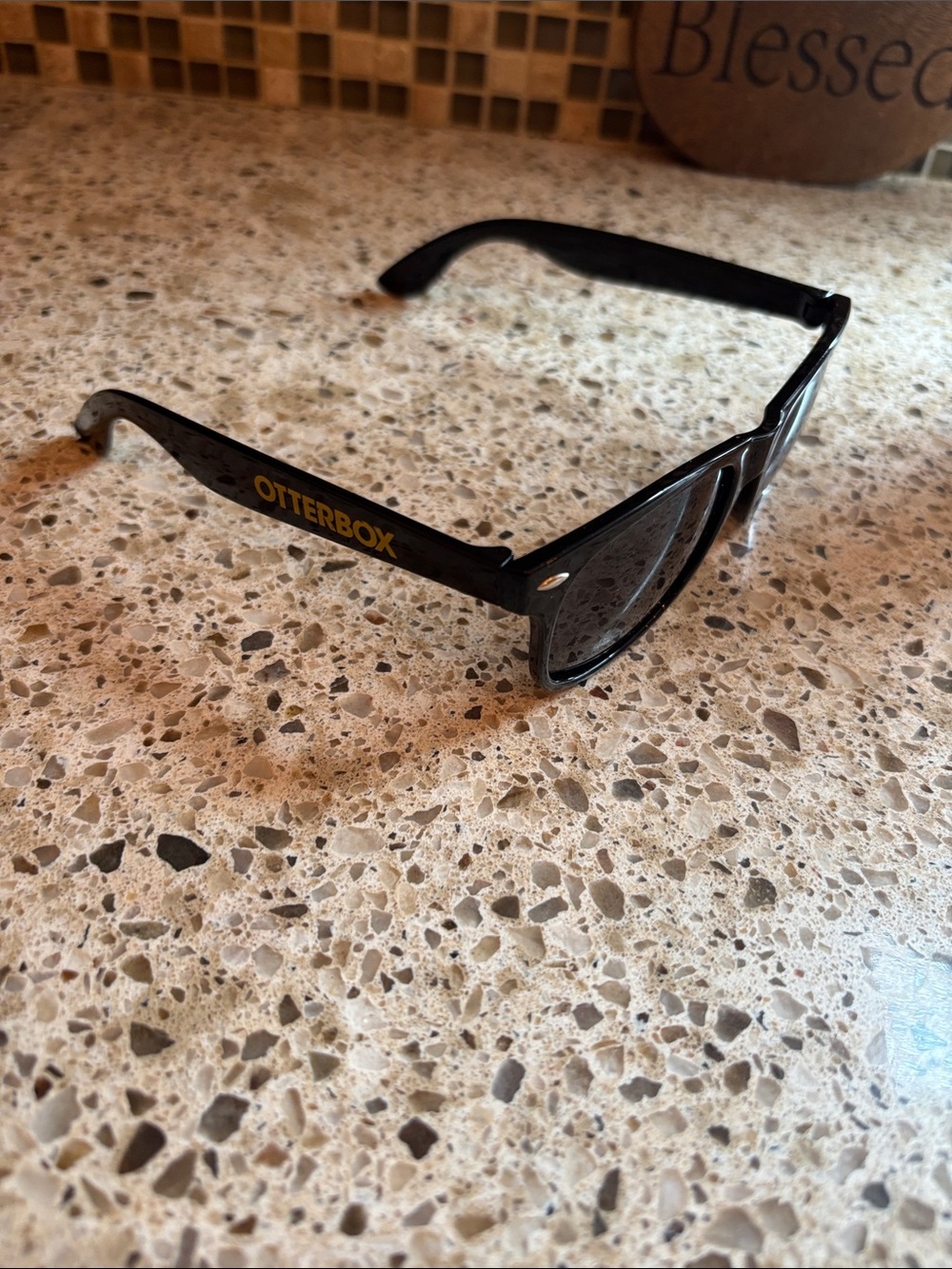 OtterBox Black Sunglasses with Gold Logo Text